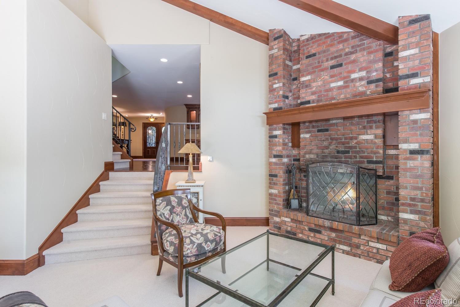 45 West Ranch Trail Morrison, CO 80465 - Photo 14 of 35 a living room with furniture and a floor to ceiling window