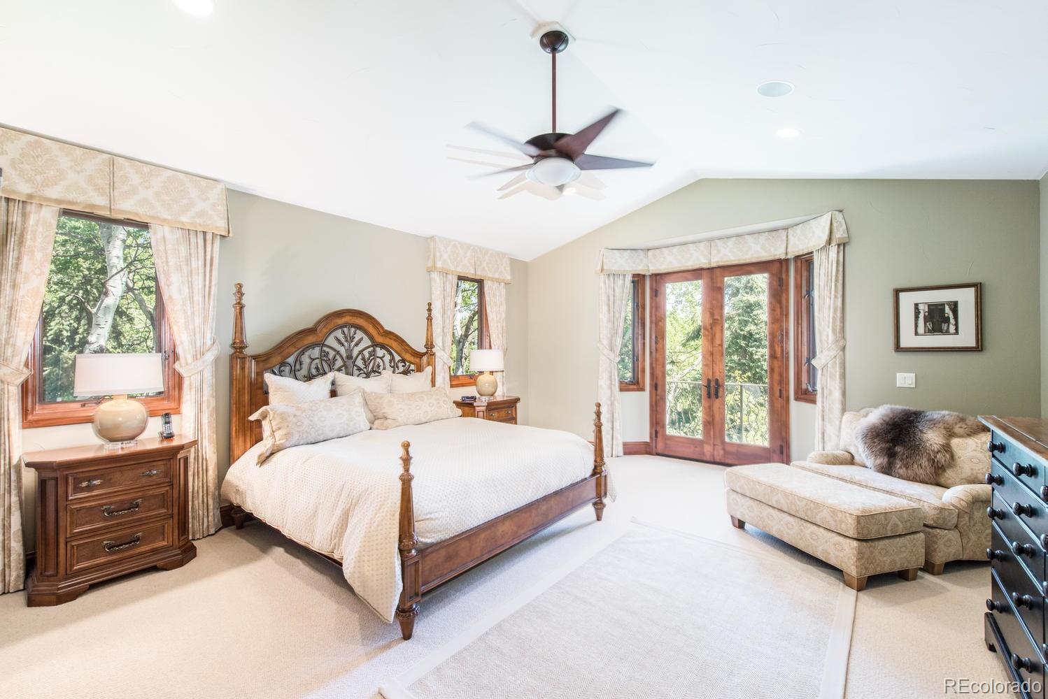 45 West Ranch Trail Morrison, CO 80465 - Photo 16 of 35 a bedroom with a bed and a window