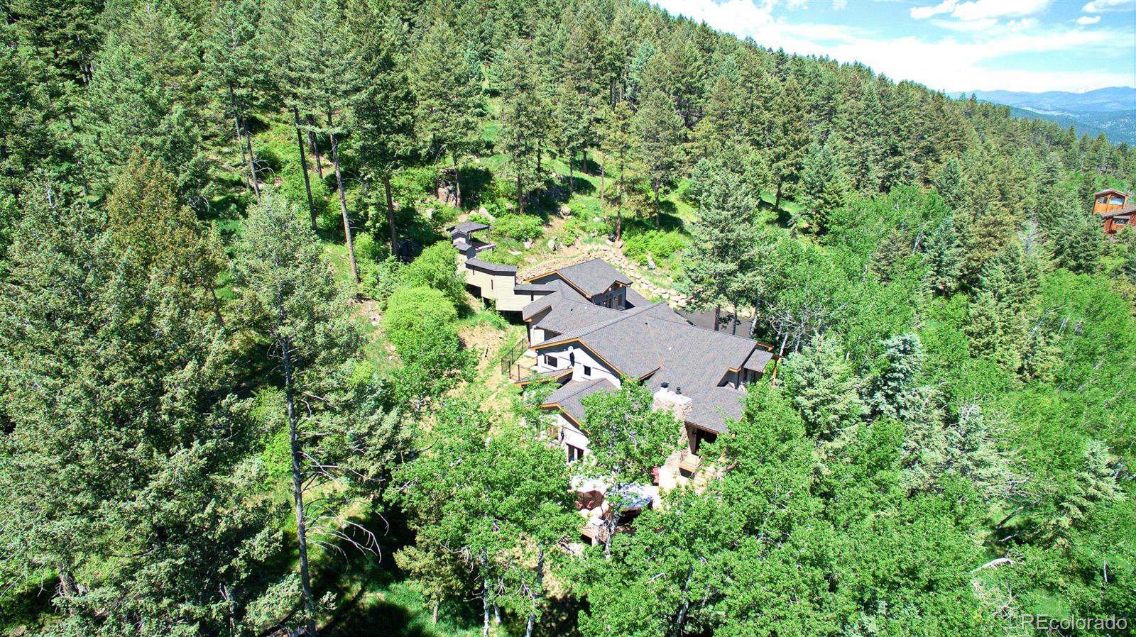 45 West Ranch Trail Morrison, CO 80465 - Photo 34 of 35 an aerial view of residential house with outdoor space and trees all around