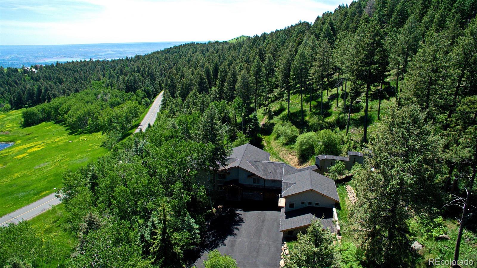 45 West Ranch Trail Morrison, CO 80465 - Photo 35 of 35 an aerial view of a house with yard and outdoor seating