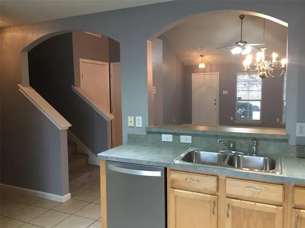 a kitchen with a sink and cabinets