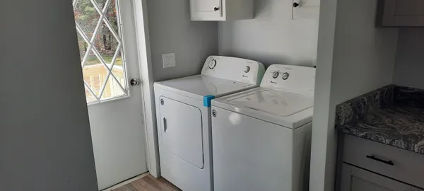 a utility room with dryer and washer