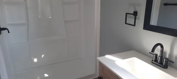 a bathroom with a sink and mirror