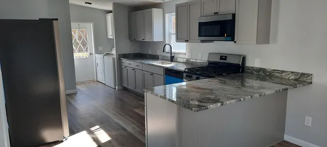 a view of bedroom with wooden floor