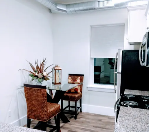 a kitchen with a microwave a stove and refrigerator