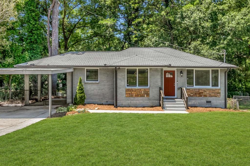1249 Richard Road Decatur, GA 30032 - Photo 1 of 1 a house view with a sitting space and garden