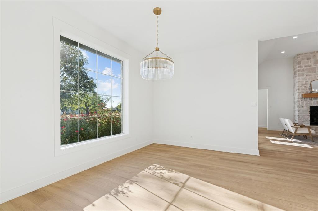 8008 Ben Day Murrin Road Fort Worth, TX 76126 - Photo 13 of 40 a view of a room with wooden floor and windows