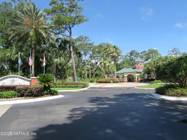 a front view of a house with a yard and a garage