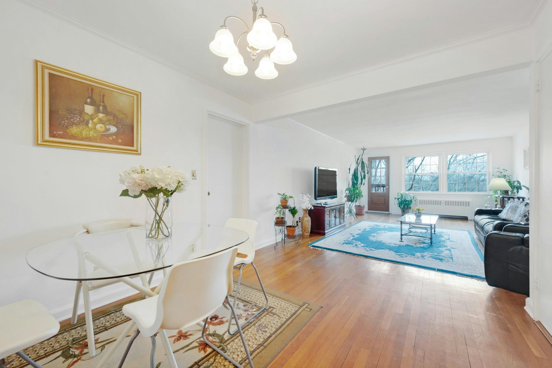 Distant view of Living room and door to balcony viewing from Dining area