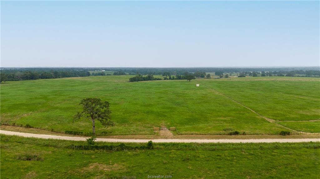 16023 Reagan Loop Franklin, TX 77856 - Photo 6 of 9 a view of a lake with a big yard