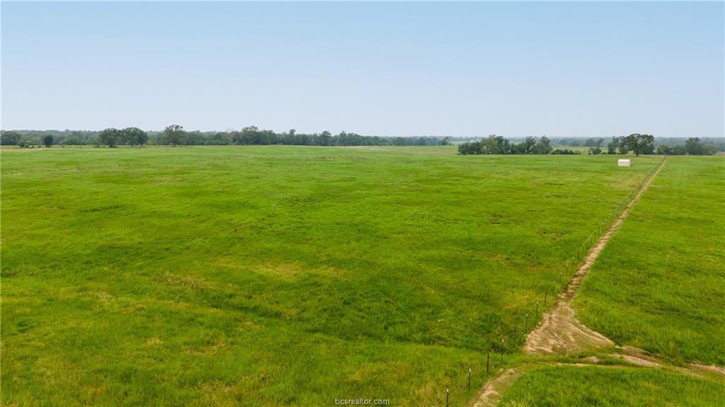 16023 Reagan Loop Franklin, TX 77856 - Photo 8 of 9 a view of a field with an ocean