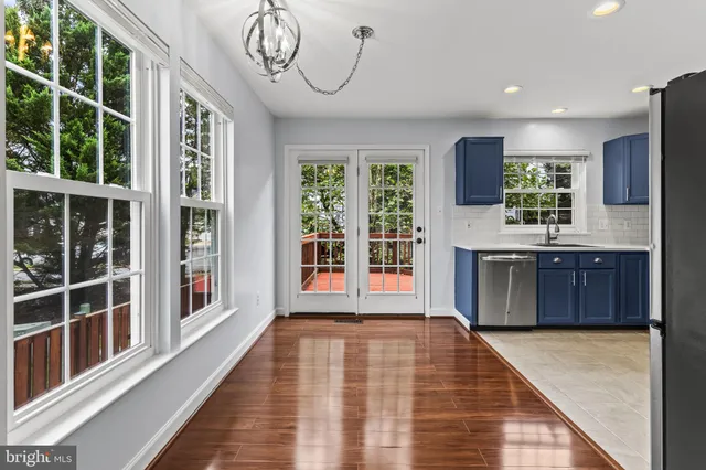 a view of a kitchen with a sink and cabinets