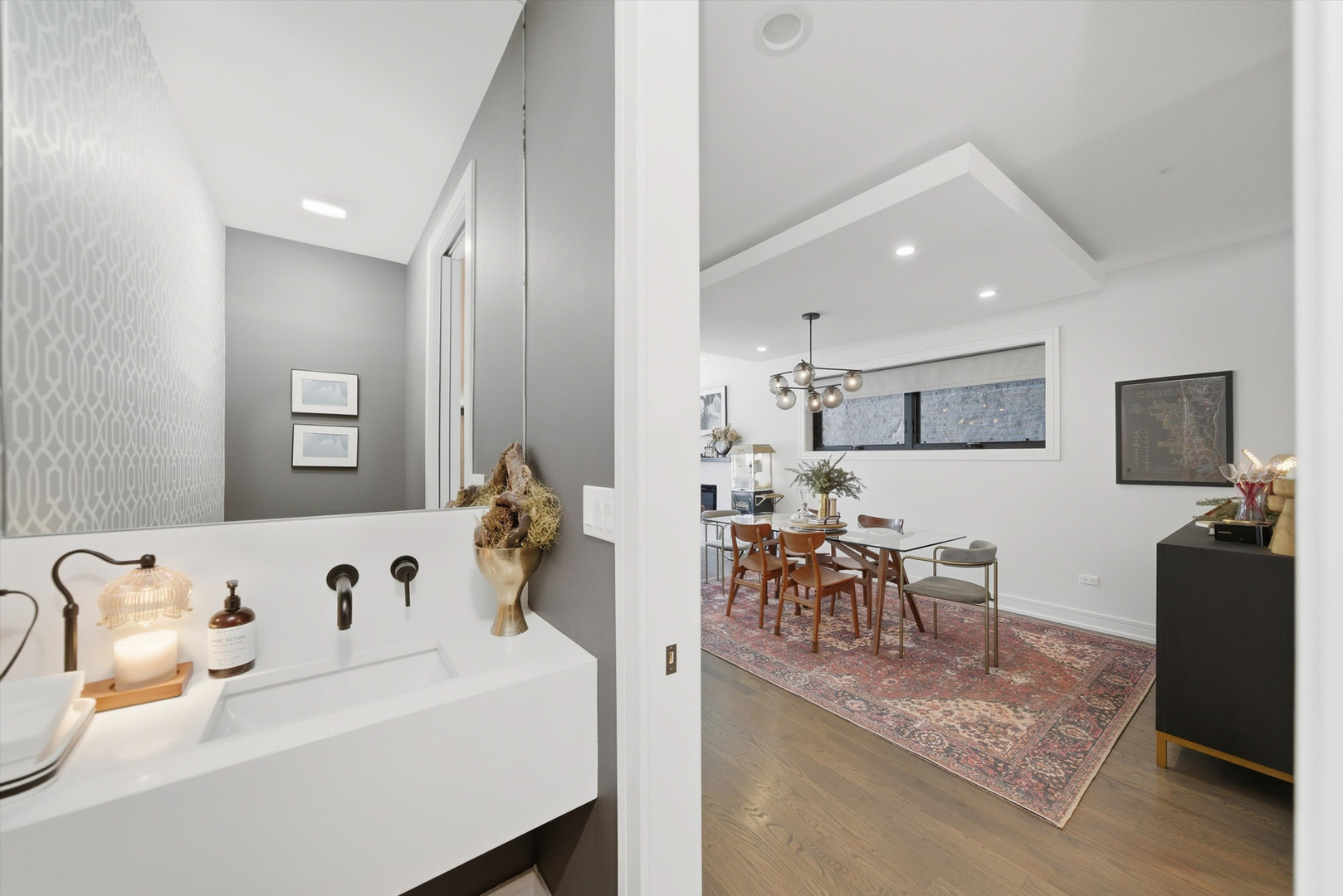 855 North Wolcott Avenue, Unit 1 Chicago, IL 60622 - Photo 16 of 34 a living room with furniture and a flat screen tv