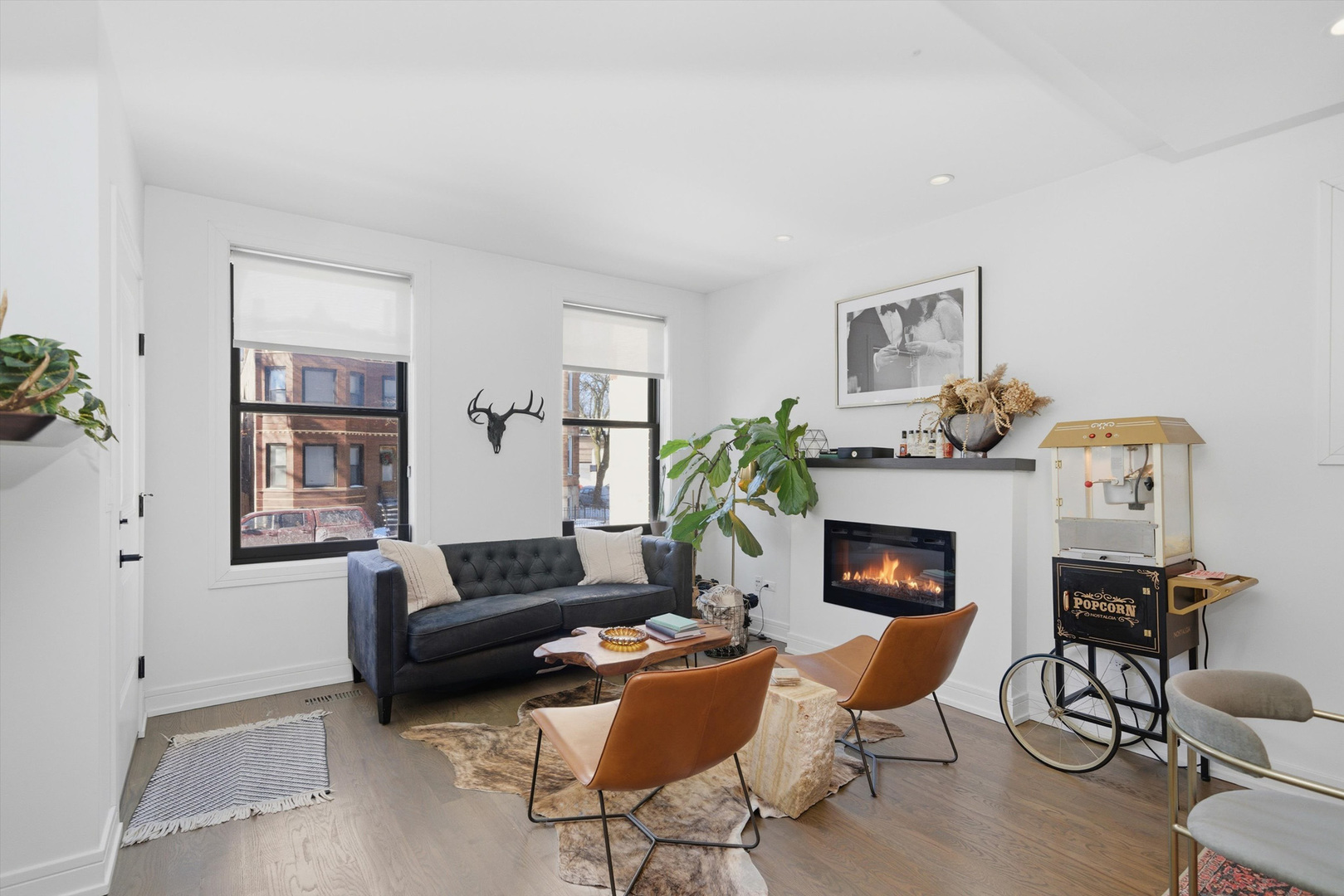 855 North Wolcott Avenue, Unit 1 Chicago, IL 60622 - Photo 18 of 34 a living room with furniture and a fireplace