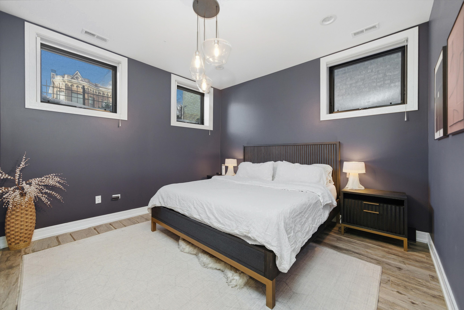 855 North Wolcott Avenue, Unit 1 Chicago, IL 60622 - Photo 20 of 34 a bedroom with a bed and lamp on table