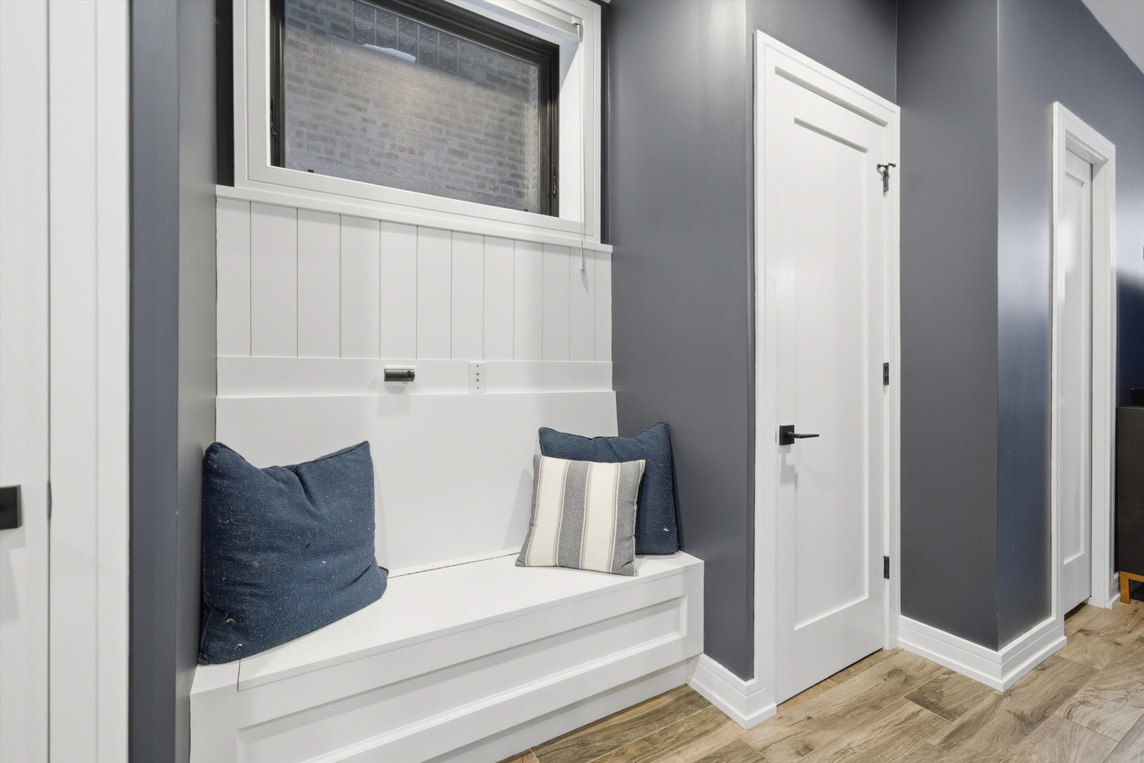 855 North Wolcott Avenue, Unit 1 Chicago, IL 60622 - Photo 23 of 34 a view of a hallway with bed and wooden floor