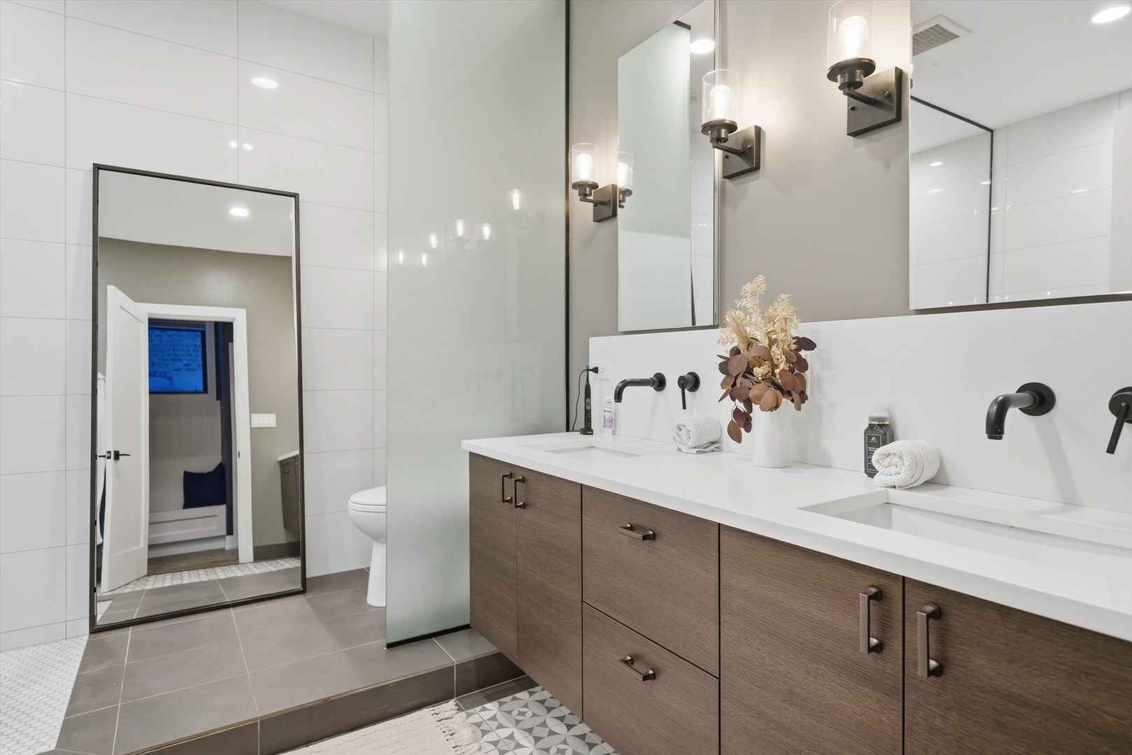 855 North Wolcott Avenue, Unit 1 Chicago, IL 60622 - Photo 24 of 34 a bathroom with a sink and a mirror