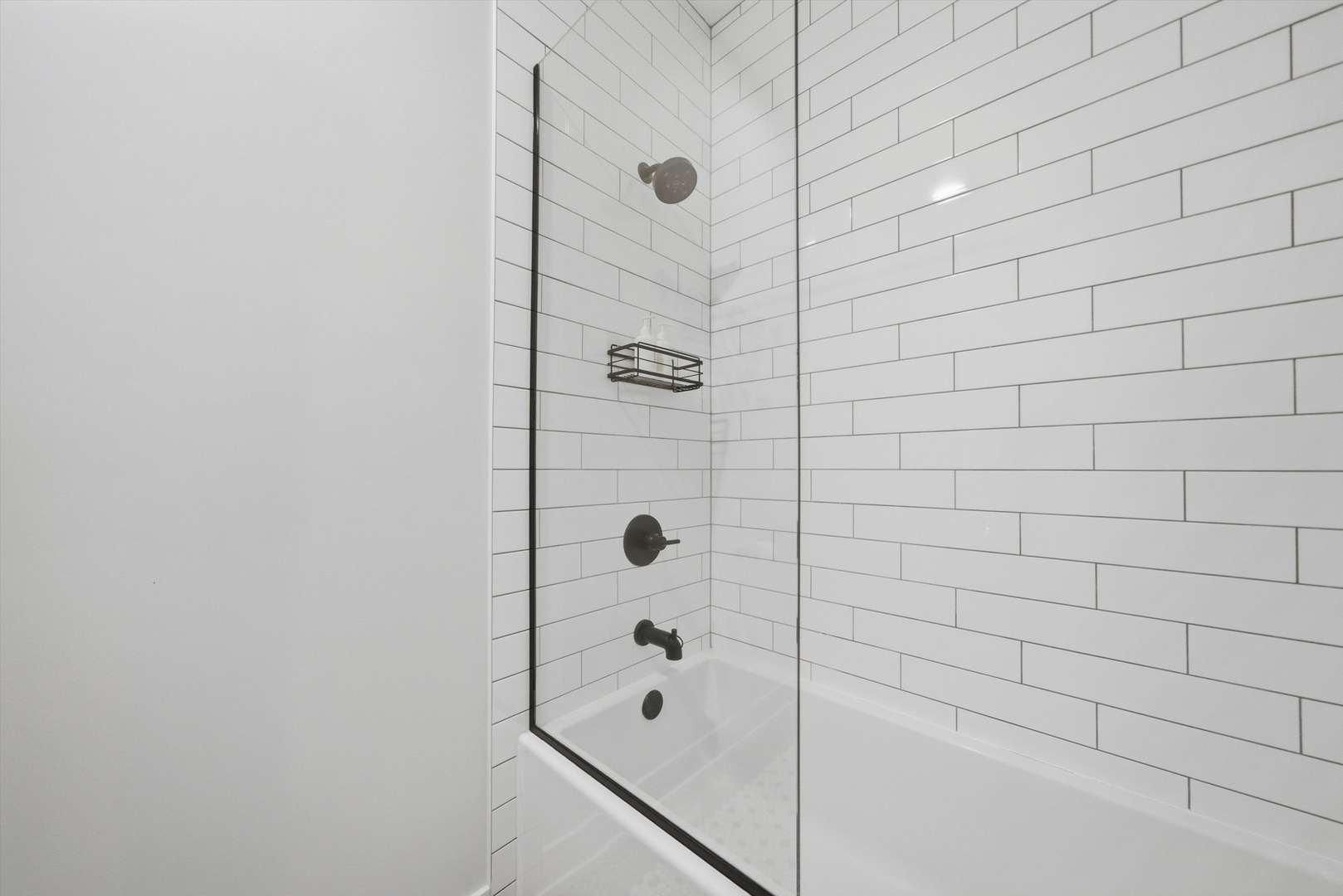 855 North Wolcott Avenue, Unit 1 Chicago, IL 60622 - Photo 30 of 34 a bathroom with a shower