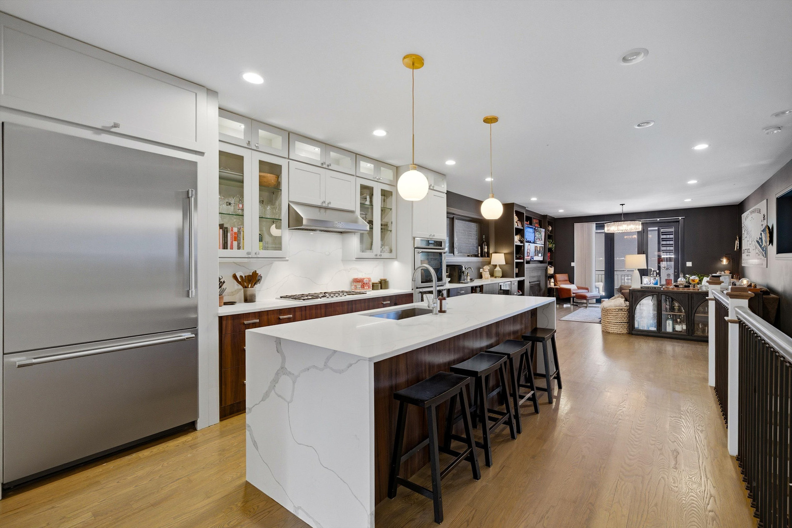 855 North Wolcott Avenue, Unit 1 Chicago, IL 60622 - Photo 8 of 34 a kitchen with stainless steel appliances granite countertop a refrigerator a sink dishwasher a stove and a refrigerator with wooden floor