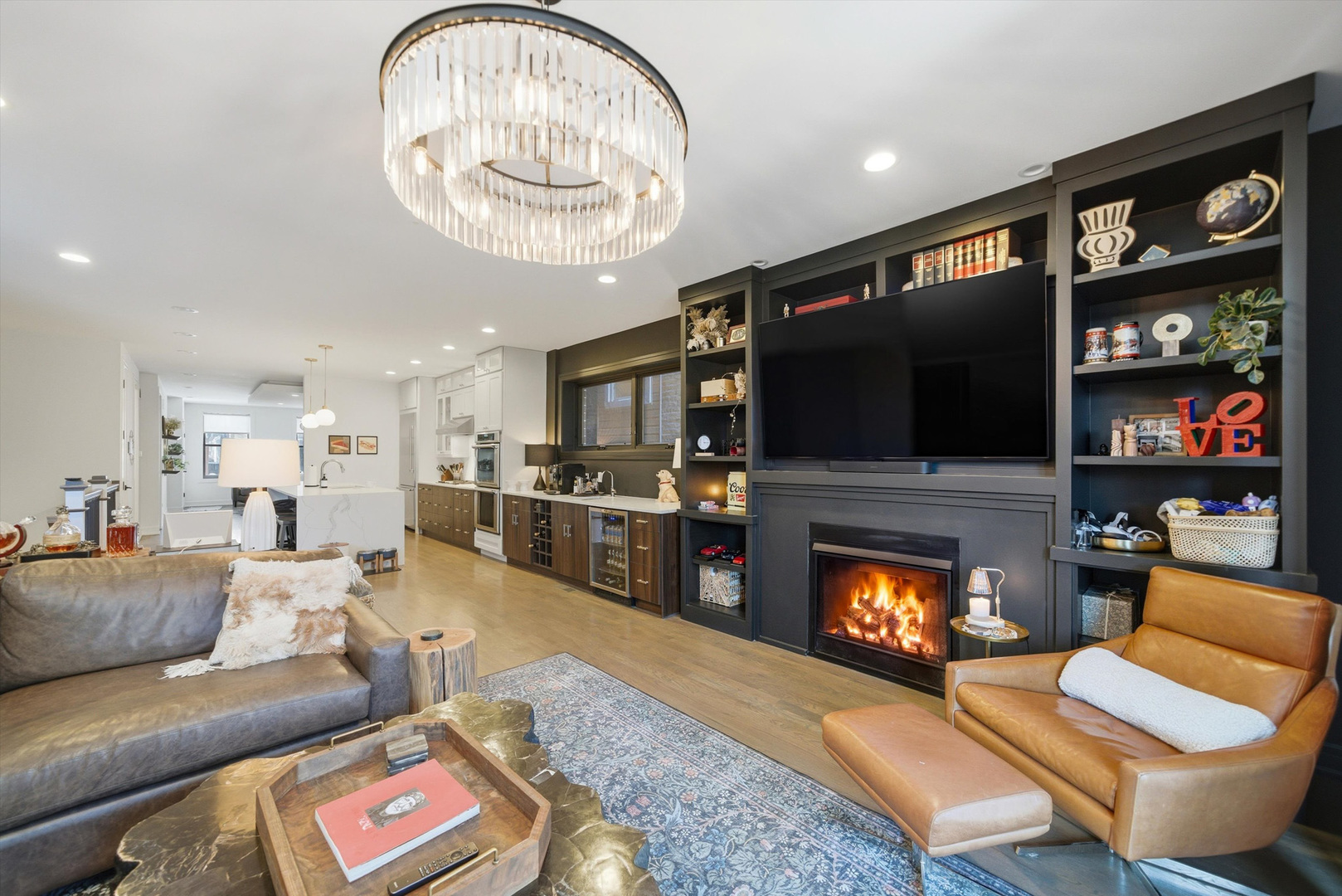 855 North Wolcott Avenue, Unit 1 Chicago, IL 60622 - Photo 10 of 34 a living room with furniture a flat screen tv and a fireplace