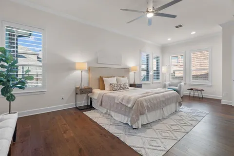 a spacious bedroom with a large bed and a window