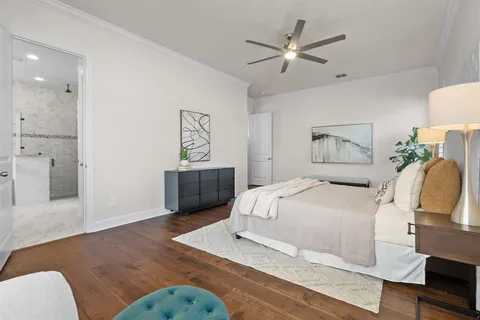 a bedroom with a bed and dresser