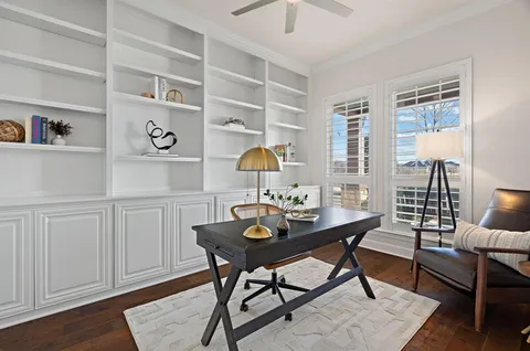 a workspace with furniture and wooden floor