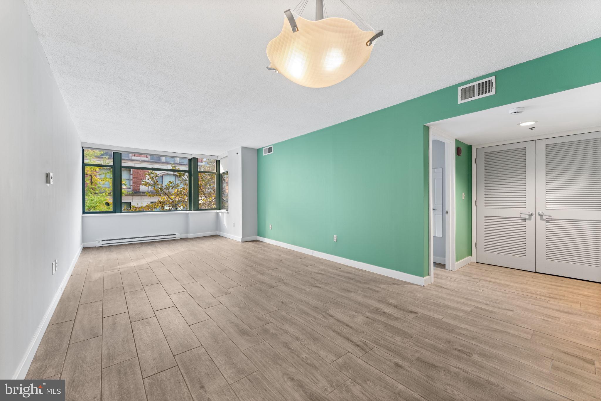 1150 K Street Northwest, Unit 306 Washington, DC 20005 - Photo 7 of 20 Expansive living area