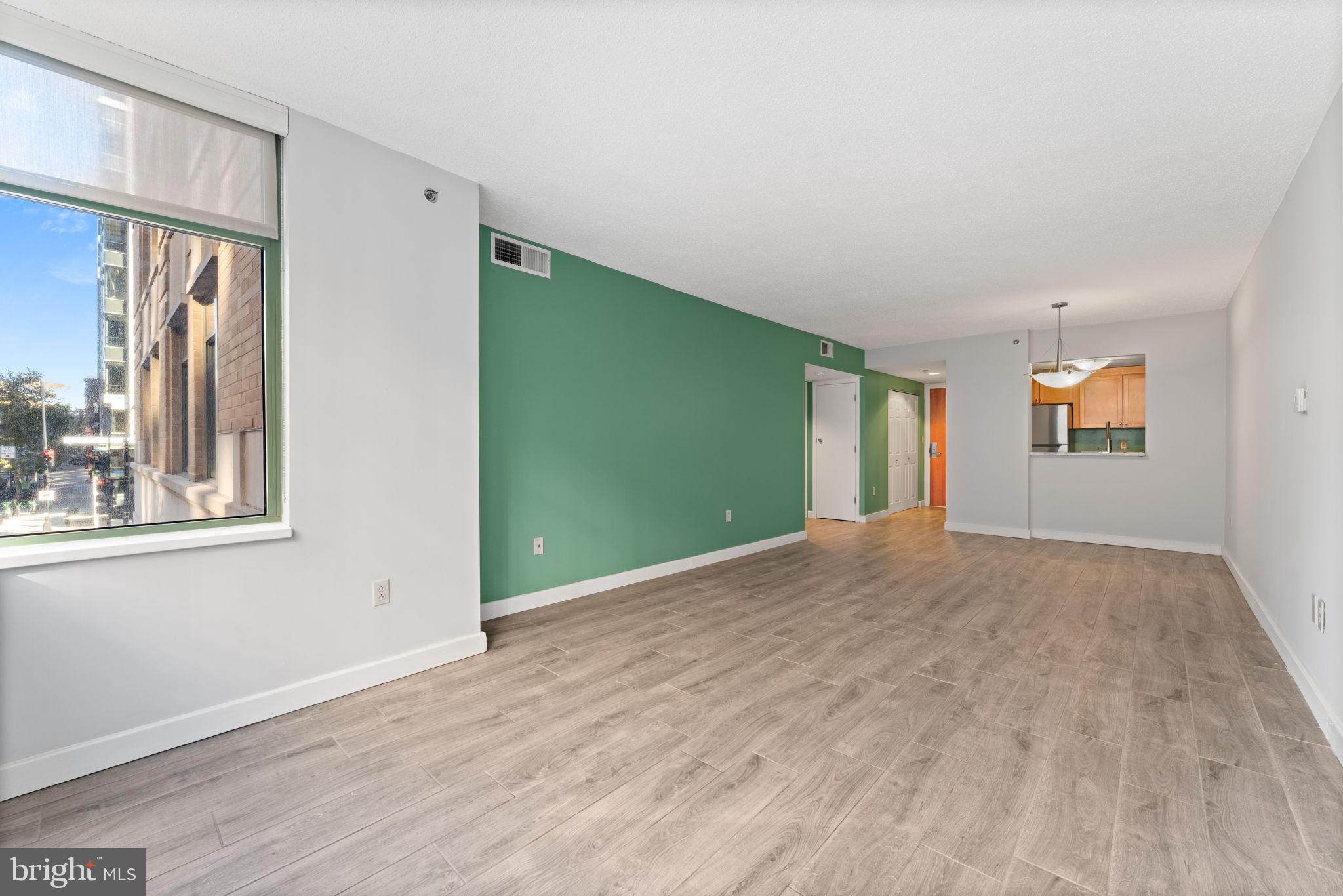 1150 K Street Northwest, Unit 306 Washington, DC 20005 - Photo 10 of 20 Expansive living and dining area