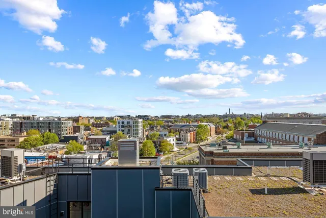 a view of a terrace with lawn chairs