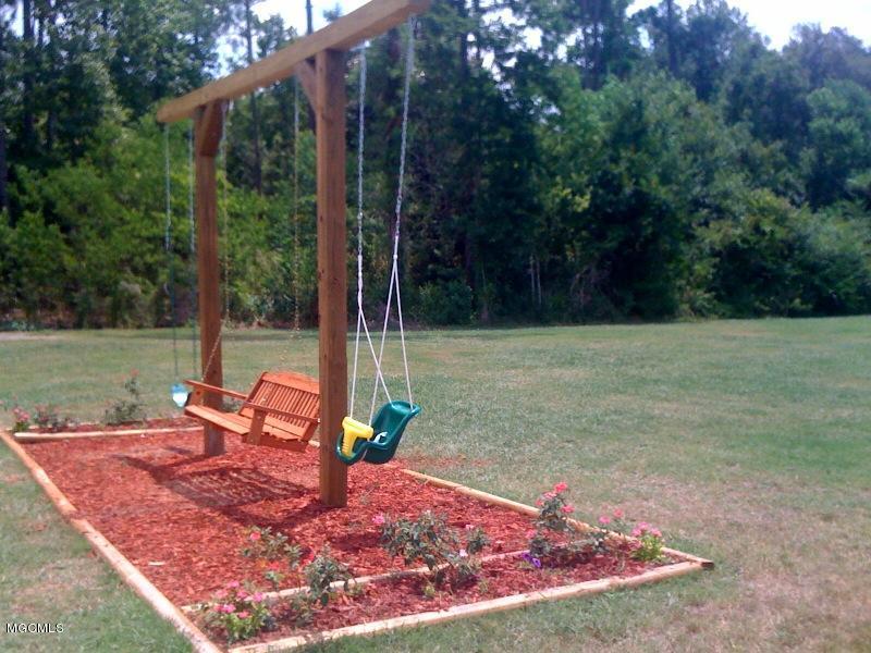 3230 Cumberland Road, Unit 4 Ocean Springs, MS 39564 - Photo 26 of 27 picnic area and swings by the bayou 2