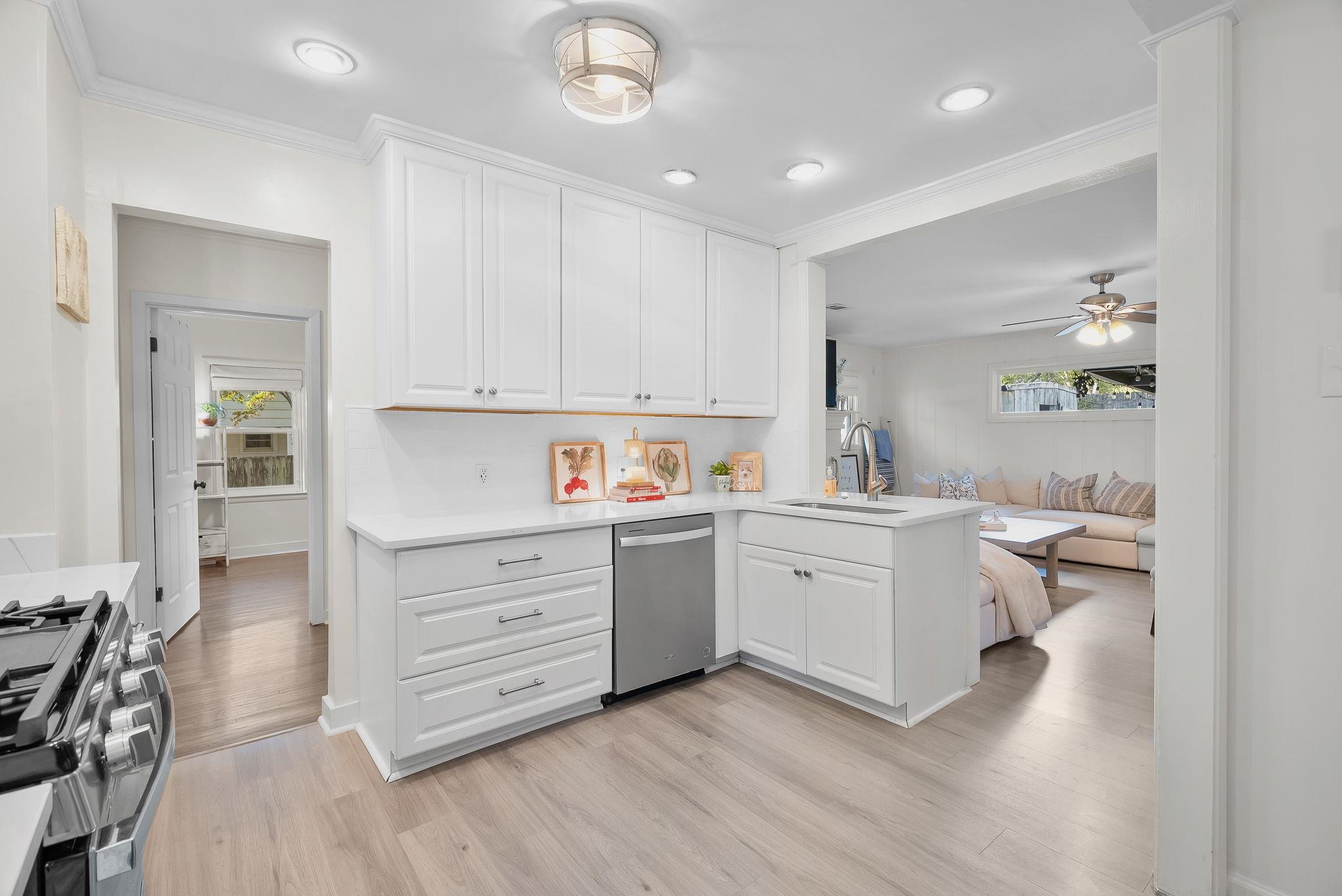 4780 Amboy Road Memphis, TN 38117 - Photo 31 of 32 a kitchen with granite countertop white cabinets and white appliances