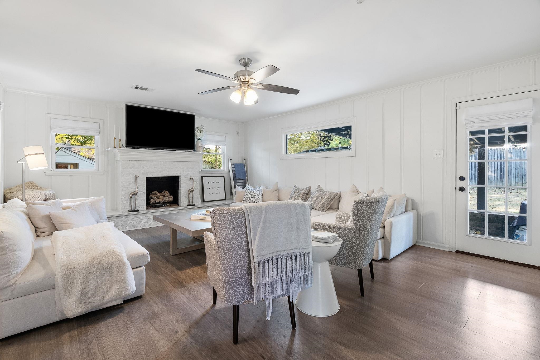 4780 Amboy Road Memphis, TN 38117 - Photo 17 of 32 a living room with fireplace furniture and a flat screen tv