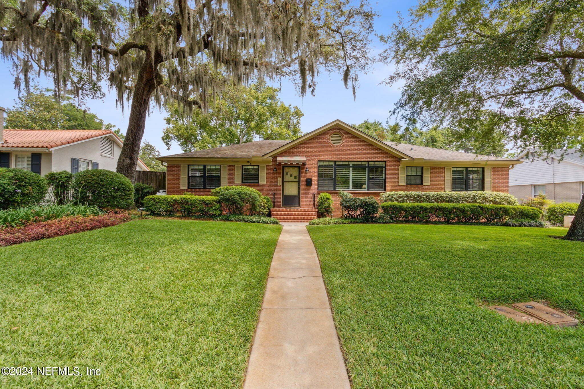 1605 Brookwood Road Jacksonville, FL 32207 - Photo 1 of 40 a front view of a house with a yard