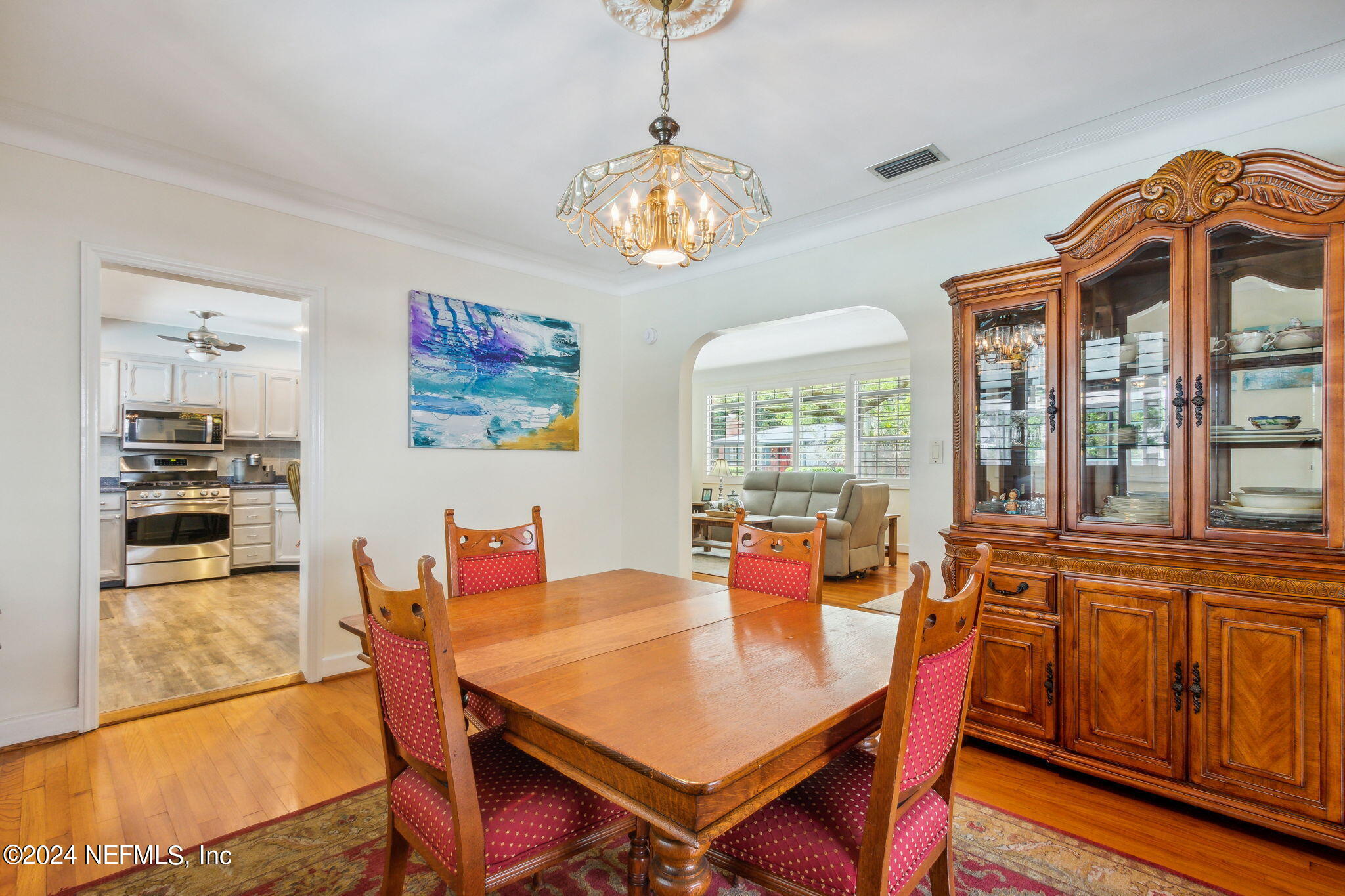 1605 Brookwood Road Jacksonville, FL 32207 - Photo 11 of 40 a dining room with furniture a window and wooden floor