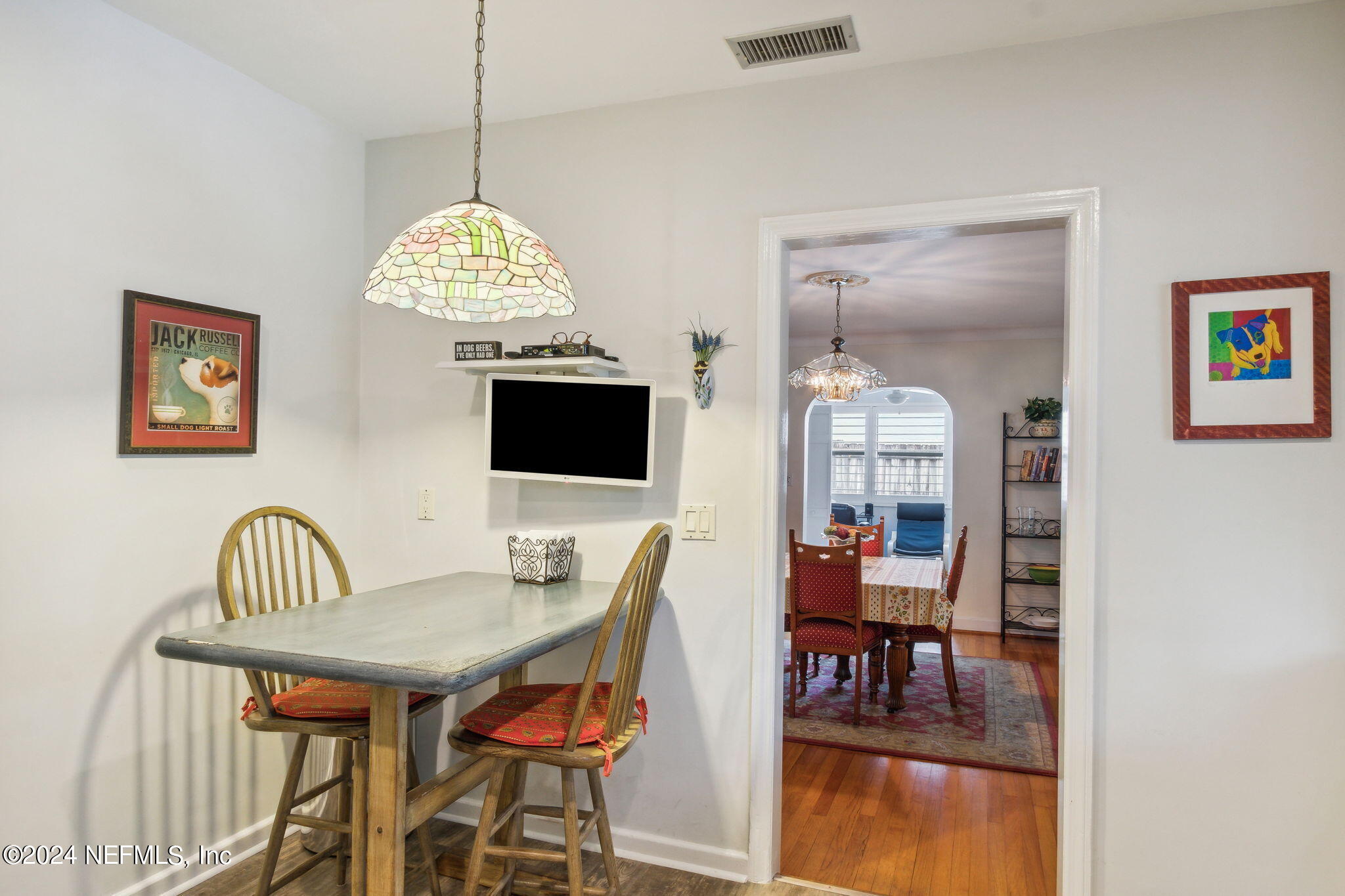 1605 Brookwood Road Jacksonville, FL 32207 - Photo 16 of 40 a view of a dining room with furniture and a chandelier