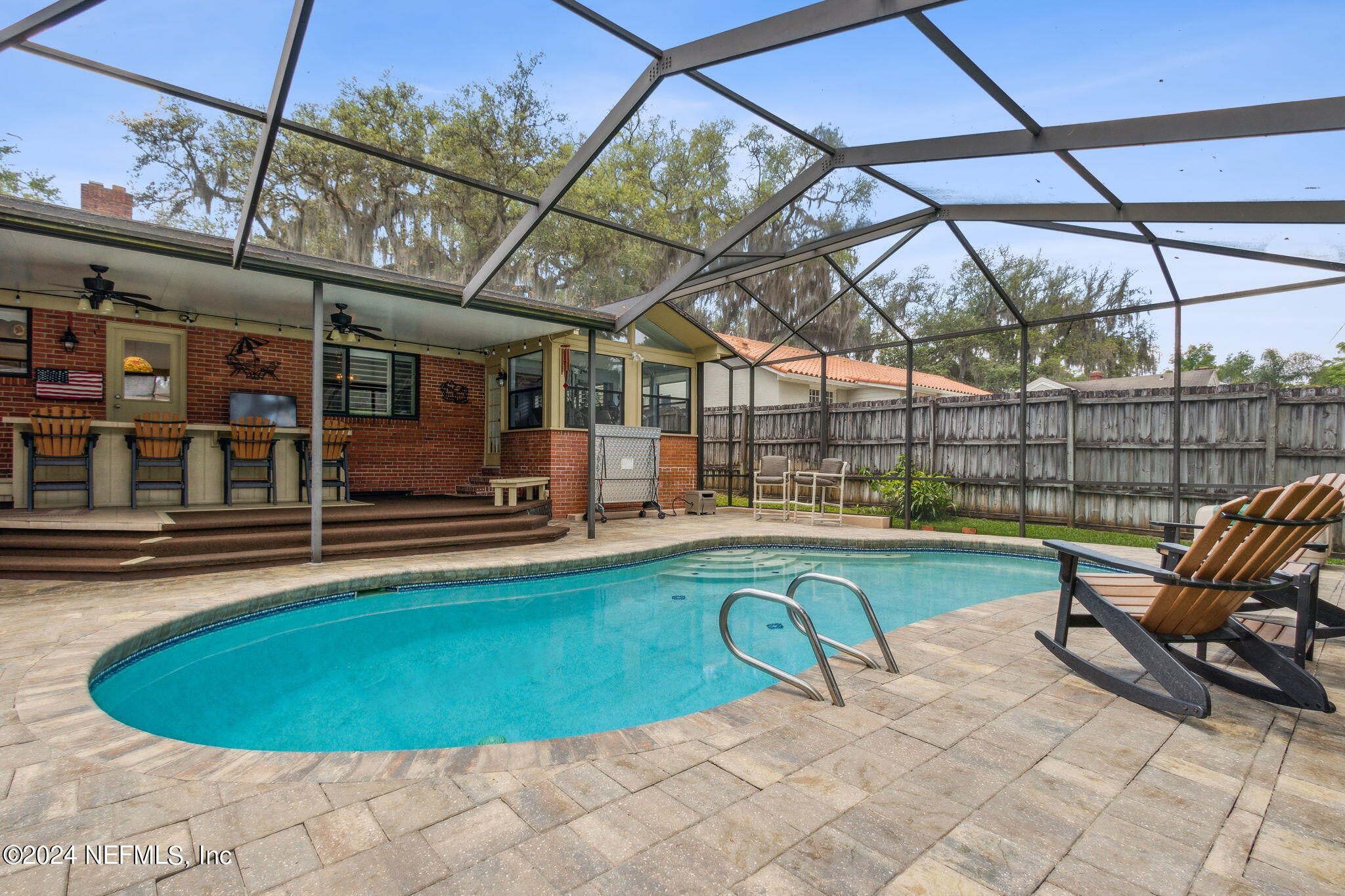 1605 Brookwood Road Jacksonville, FL 32207 - Photo 28 of 40 a view of a swimming pool with a patio and a backyard