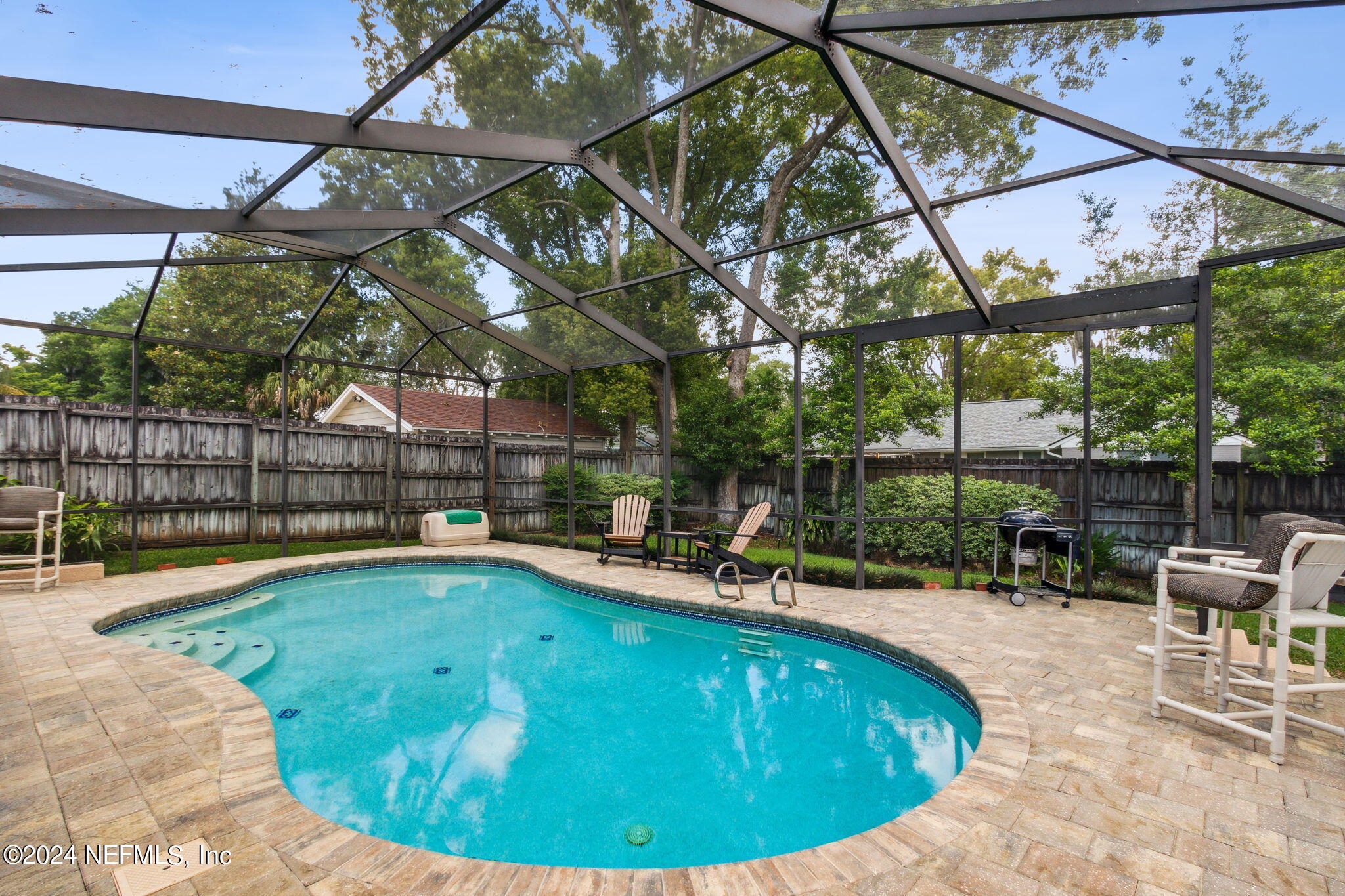 1605 Brookwood Road Jacksonville, FL 32207 - Photo 3 of 40 a view of a swimming pool with a patio