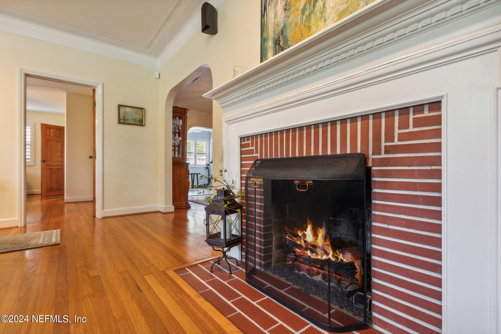 1605 Brookwood Road Jacksonville, FL 32207 - Photo 10 of 40 a view of an empty room with wooden floor fireplace and a window