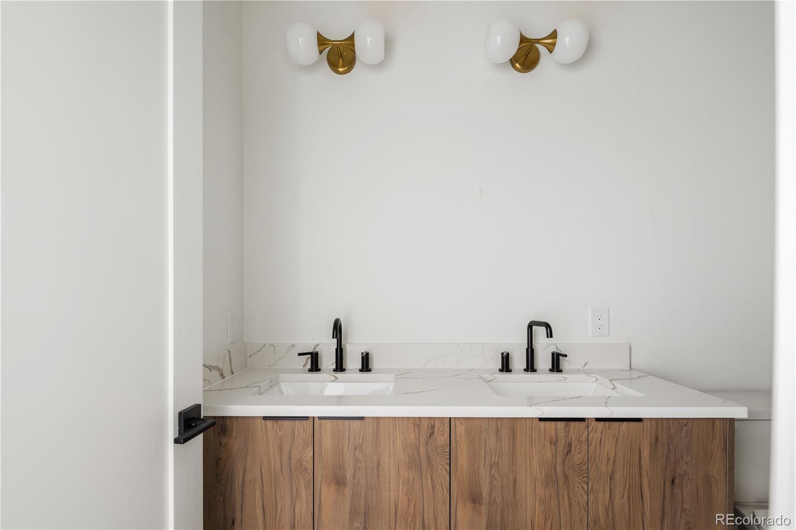 4517 Tennyson Street Denver, CO 80212 - Photo 25 of 34 a bathroom with a granite countertop sink