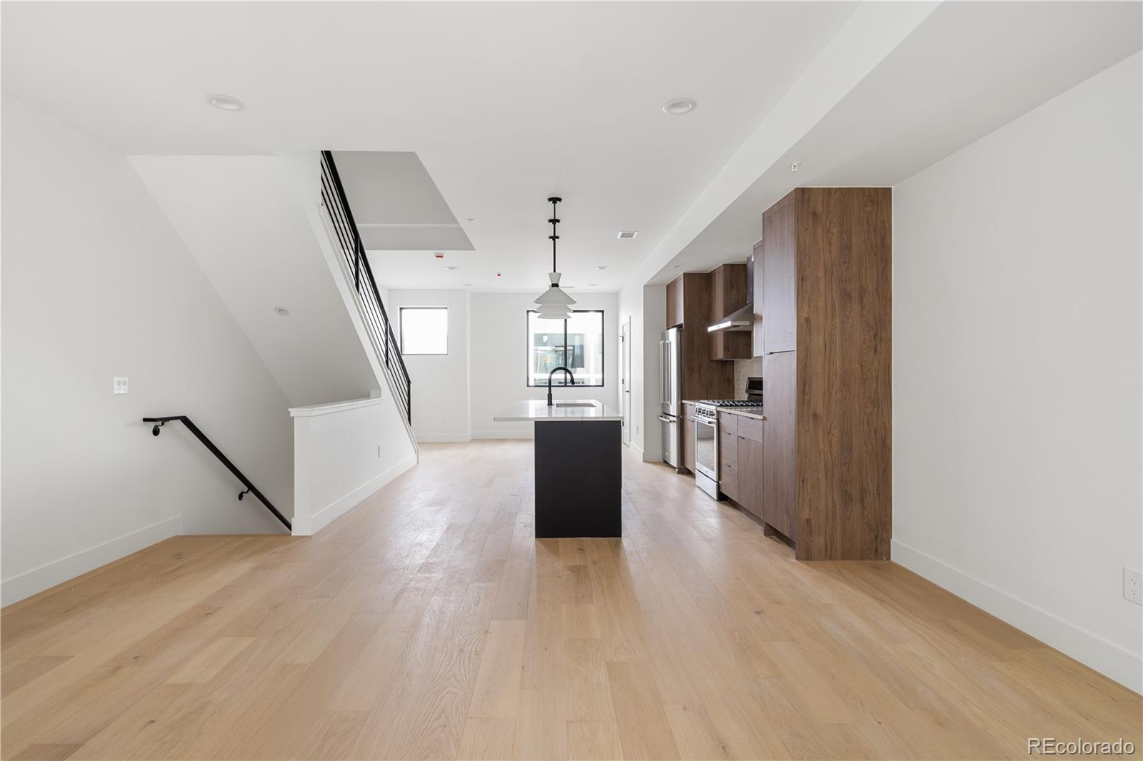 4517 Tennyson Street Denver, CO 80212 - Photo 30 of 34 a view of a hallway view with wooden floor and staircase