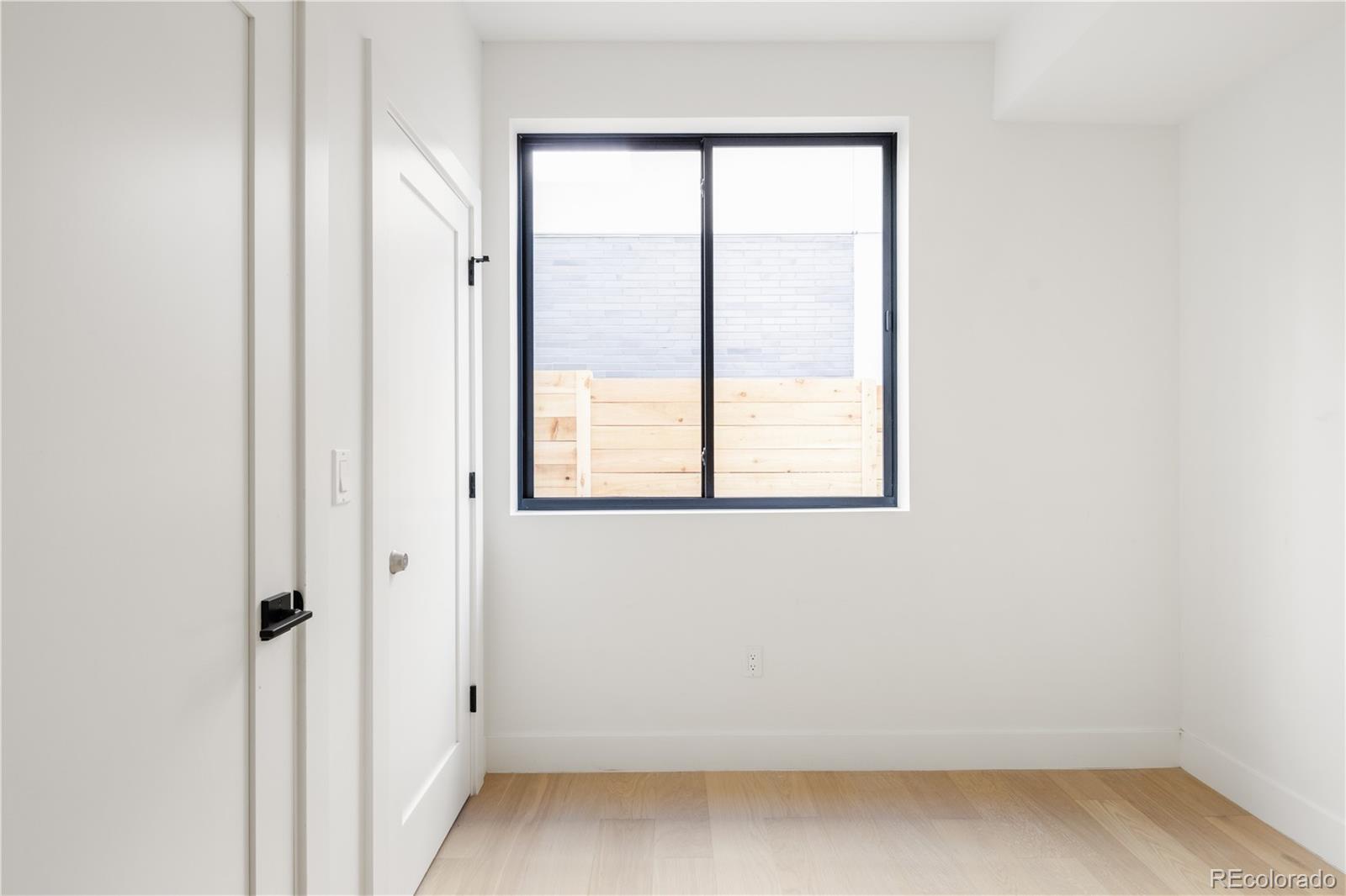 4517 Tennyson Street Denver, CO 80212 - Photo 6 of 34 an empty room with a window