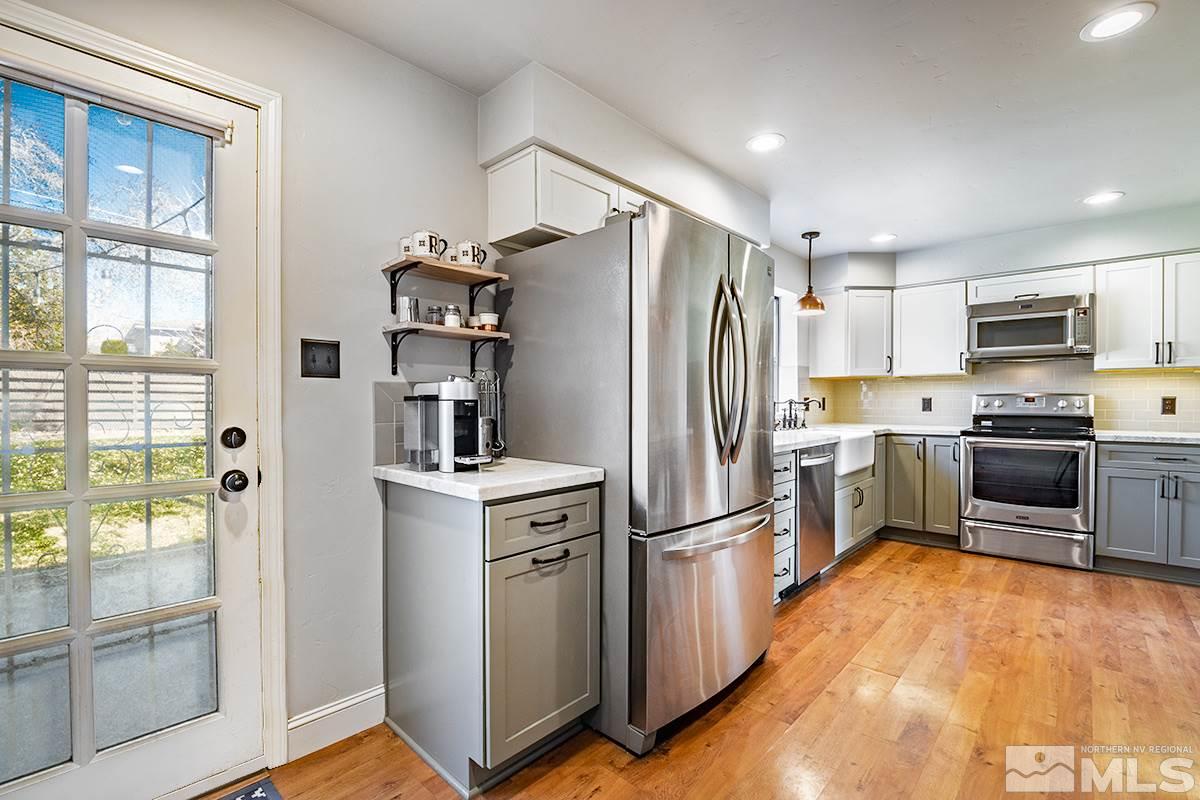 845 West 11th Street Reno, NV 89503 - Photo 11 of 23 a kitchen with a refrigerator a sink and dishwasher