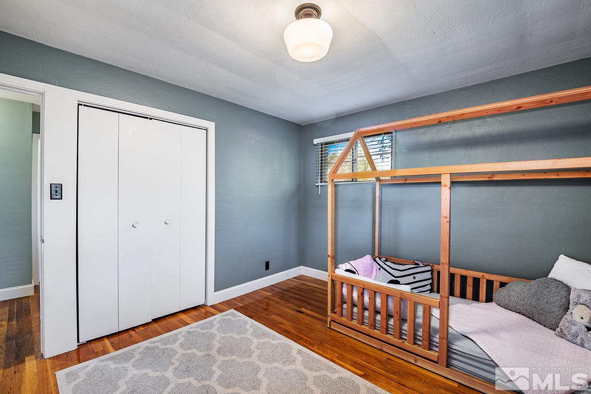 845 West 11th Street Reno, NV 89503 - Photo 16 of 23 a bedroom with a bed and a chandelier