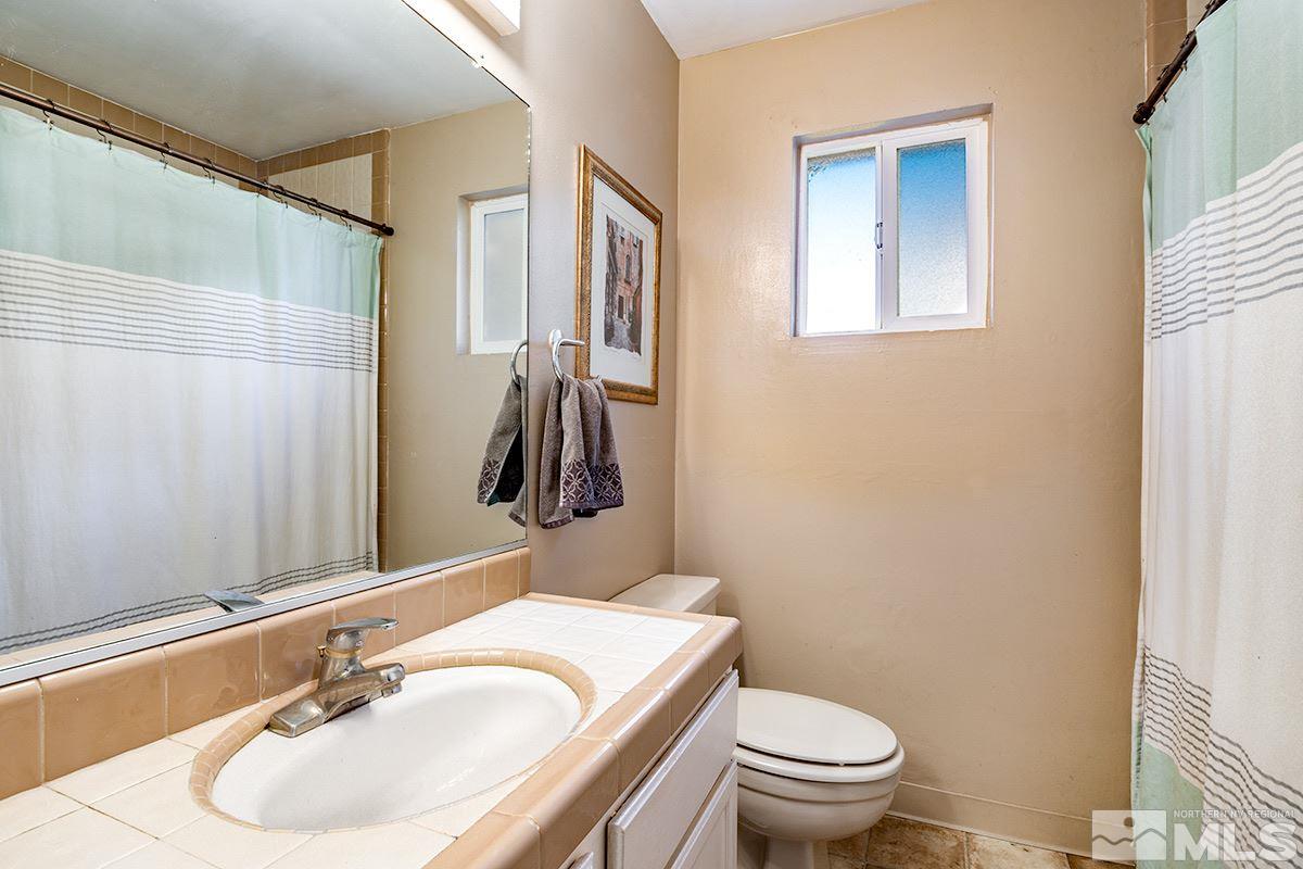 845 West 11th Street Reno, NV 89503 - Photo 18 of 23 a bathroom with a sink toilet and mirror