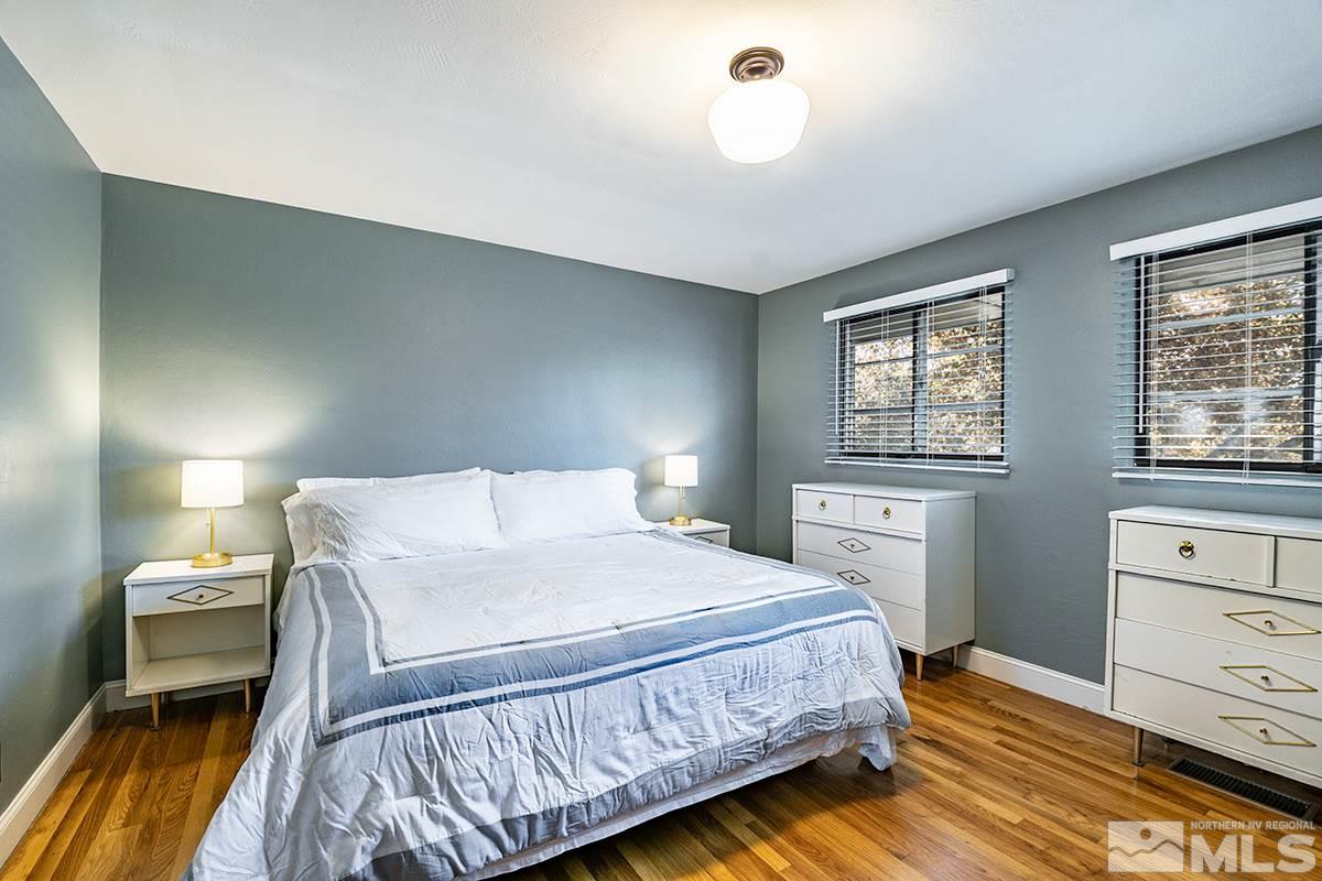 845 West 11th Street Reno, NV 89503 - Photo 19 of 23 a bedroom with a bed and wooden floor