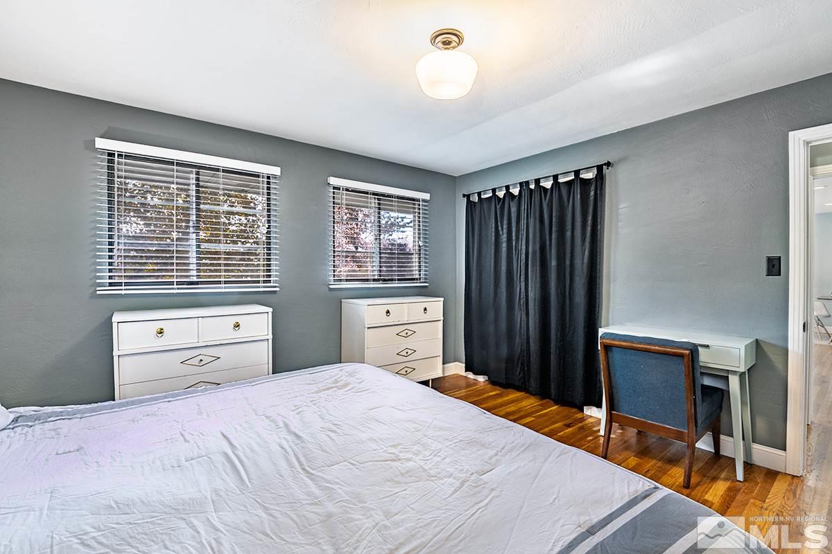 845 West 11th Street Reno, NV 89503 - Photo 20 of 23 a bedroom with a bed and a dresser with mirror