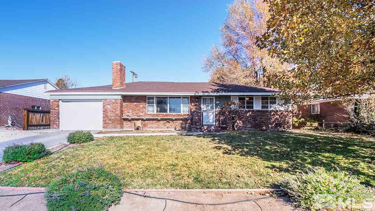 845 West 11th Street Reno, NV 89503 - Photo 2 of 23 a front view of a house with swimming pool table and chairs