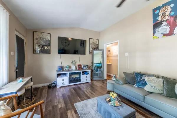 a living room with furniture and a flat screen tv