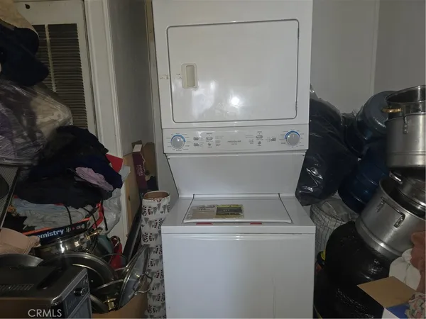 a bathroom with a granite countertop shower a toilet and a sink